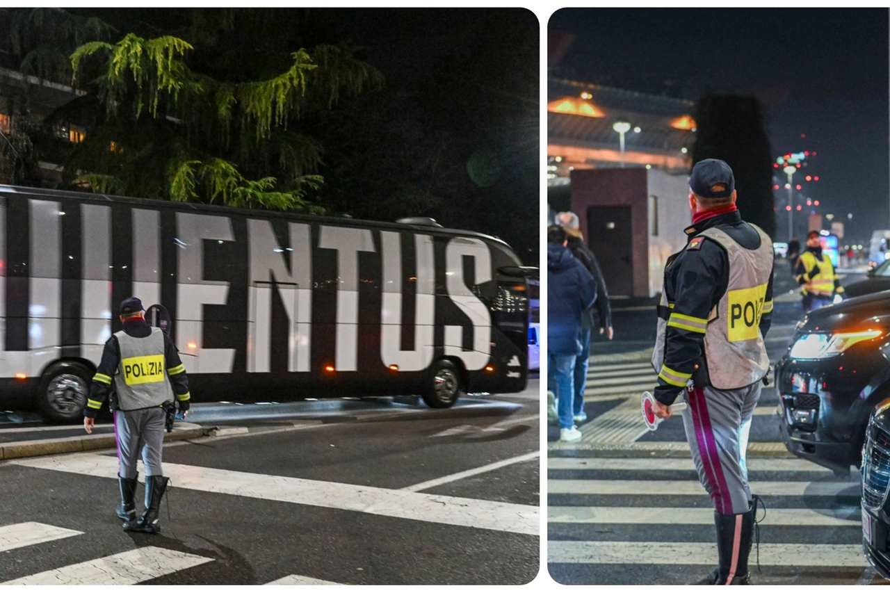 Uno dei pullman della Juventus e la polizia attorno a San Siro