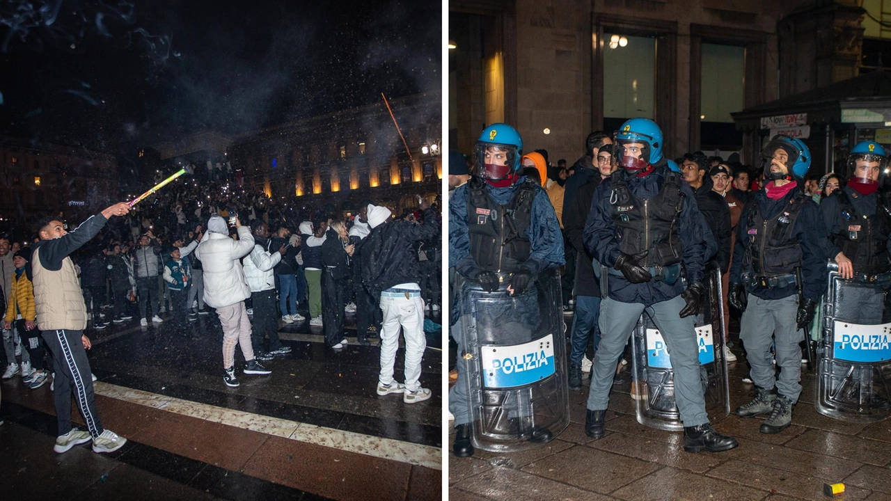 Festeggiamenti in piazza Duomo e polizia anti-sommossa schierata per l'intervento (Ansa/Davide Canella)